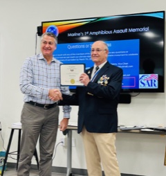 FLSSAR Chancellor Charles Klug (left) receiving FAAM Fellow Certificate and commemorative coin from Robbie Robinson (right)