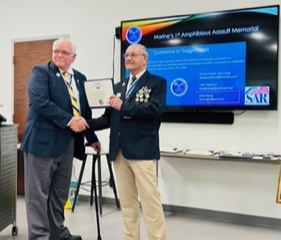 Fellow FAAM Committee member Dick Young (left) receiving FAAM Minuteman certificate from FAAM secretary Robbie Robinson (right)