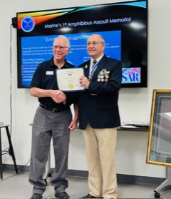 John Black (left) receiving FAAM Fellow Certificate and commemorative coin from Robbie Robinson (right) at Tampa SAR Chapter meeting