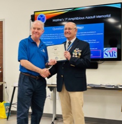 Compatriot Terry Doan (left) receiving Minuteman Certificate from Robbie Robinson (right) at Tampa SAR Chapter meeting