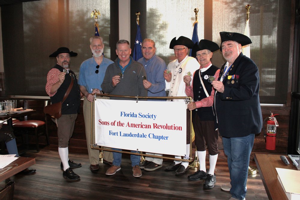 Florida Society Sons of the American Revolution Fort Lauderdale Chapter members with commemorative coins