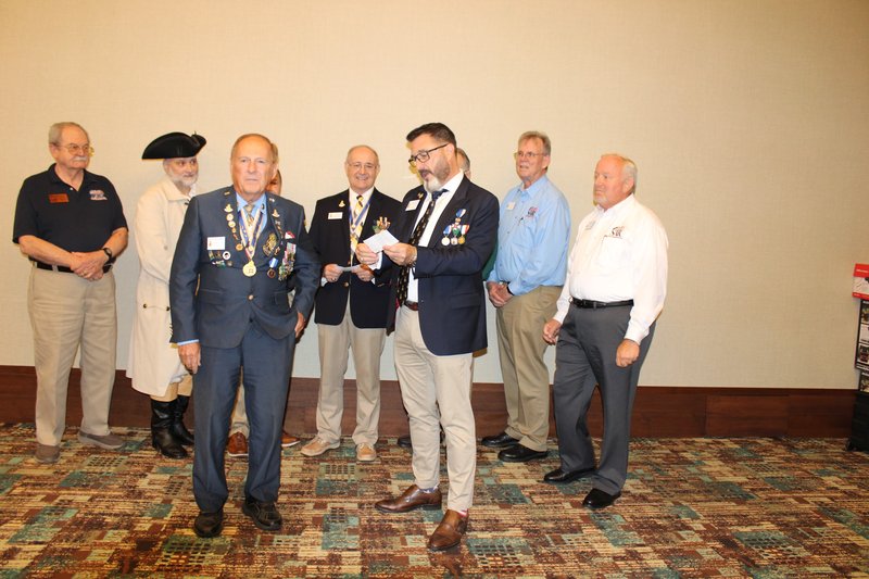 Brad Marble making a personal donation of $2,500 to the FAAM at the 2025 Fall Board of Management meeting