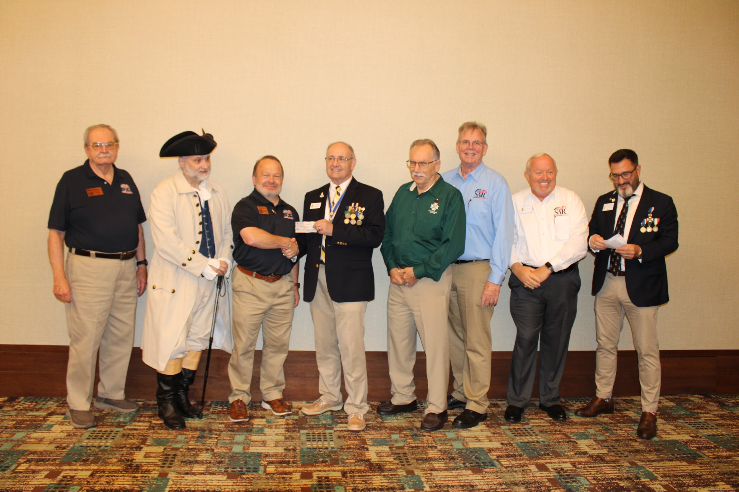 FAAM Committee accepting $1,000 donation from FLSSAR President Washler at the 2025 Fall Board of Management meeting