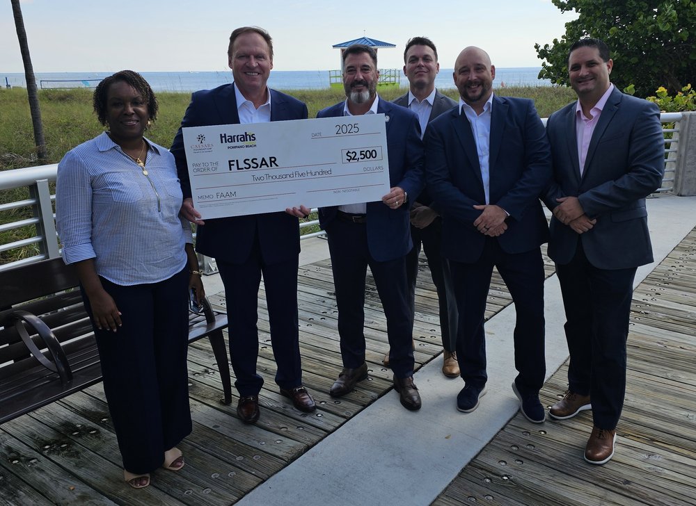 SAR FAAM Chair (third from left) receives $2,500 donation check from Harrah's-Caesars President Barron Fuller (second from left) and his team
